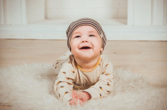 baby wearing cap